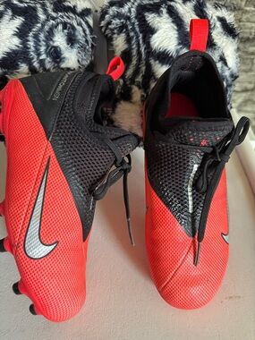 Nike Red and Black Youth Soccer Cleats with Silver Swoosh
